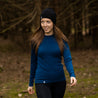 Alpin Loacker Dames Merino Shirt met lange mouwen in blauw, Vrouw in het bos met Merino Shirt met lange mouwen door Alpin Loacker
